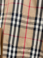 Burberry plaid shirt chest panel showing stitched seams and beige navy red checks
