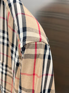 Burberry plaid shirt sleeve with cuff and beige, navy, and red check pattern