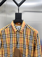 Burberry plaid button-up shirt close-up on hanger, pointed collar and button placket
