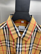 Burberry plaid shirt collar close-up with button placket and brand label