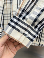 Plaid shirt cuff with button and folded hem detail, Burberry