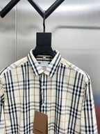 Long-sleeve plaid button-up shirt collar, cream with navy and tan checks.