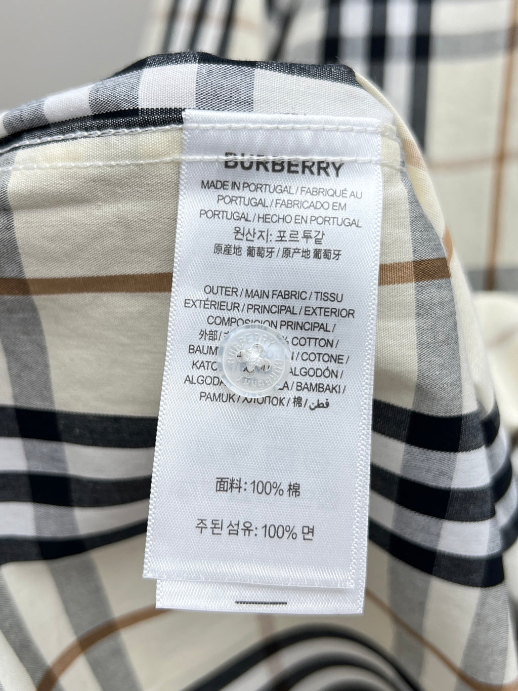 Burberry inner label on plaid long-sleeve shirt with cotton fabric info