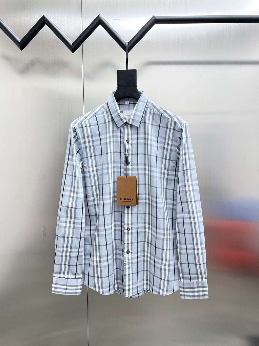 Burberry long-sleeve button-up shirt in light blue and white plaid, front view