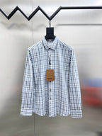 Burberry long-sleeve button-up shirt in light blue and white plaid, front view