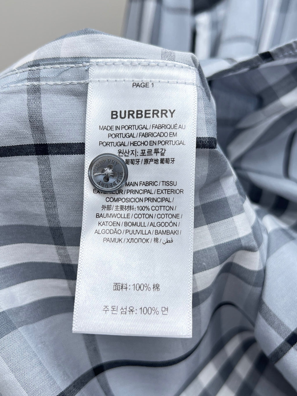 Burberry plaid shirt label with care and fabric composition info