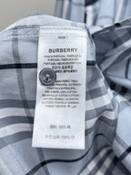 Burberry plaid shirt label with care and fabric composition info