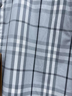 Burberry plaid button-up shirt with light blue and white check pattern, chest view