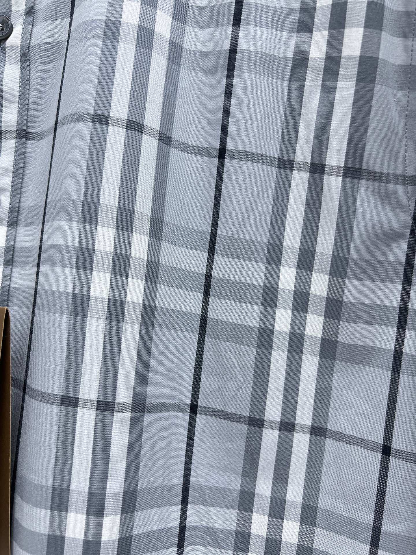 Burberry plaid button-up shirt with light blue and white check pattern, chest view
