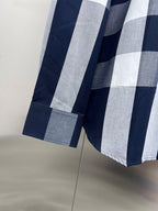Burberry check shirt sleeve cuff detail with navy and gray/white stripes