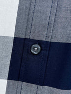Burberry shirt button on check fabric with navy and gray/white squares