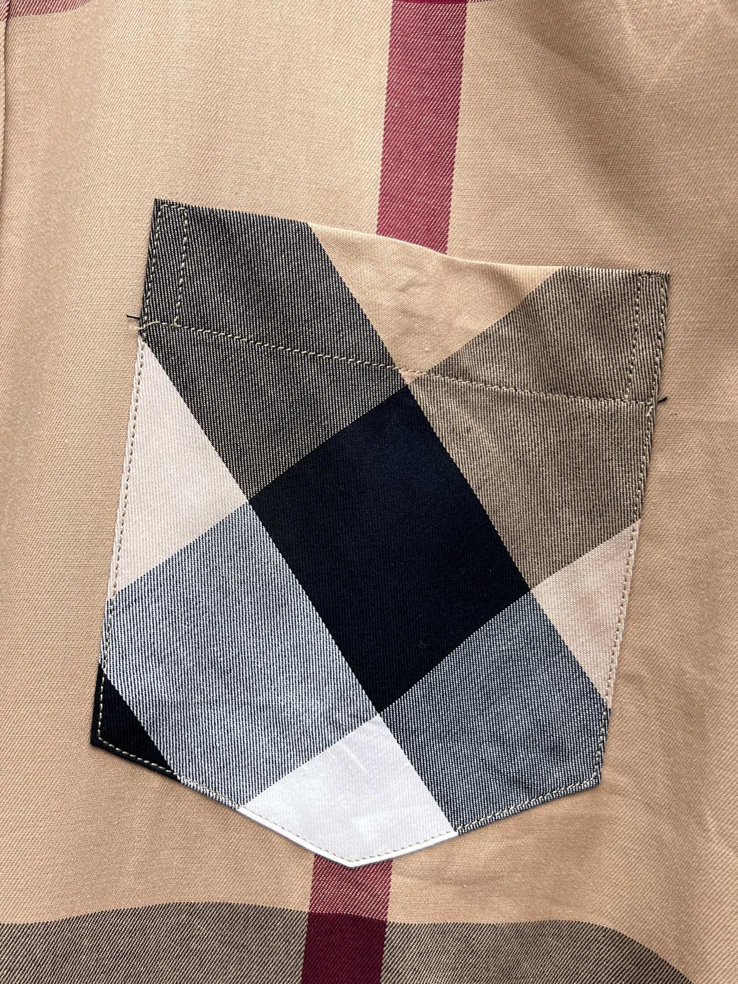 Plaid chest patch with geometric appliqué in navy, gray, and cream