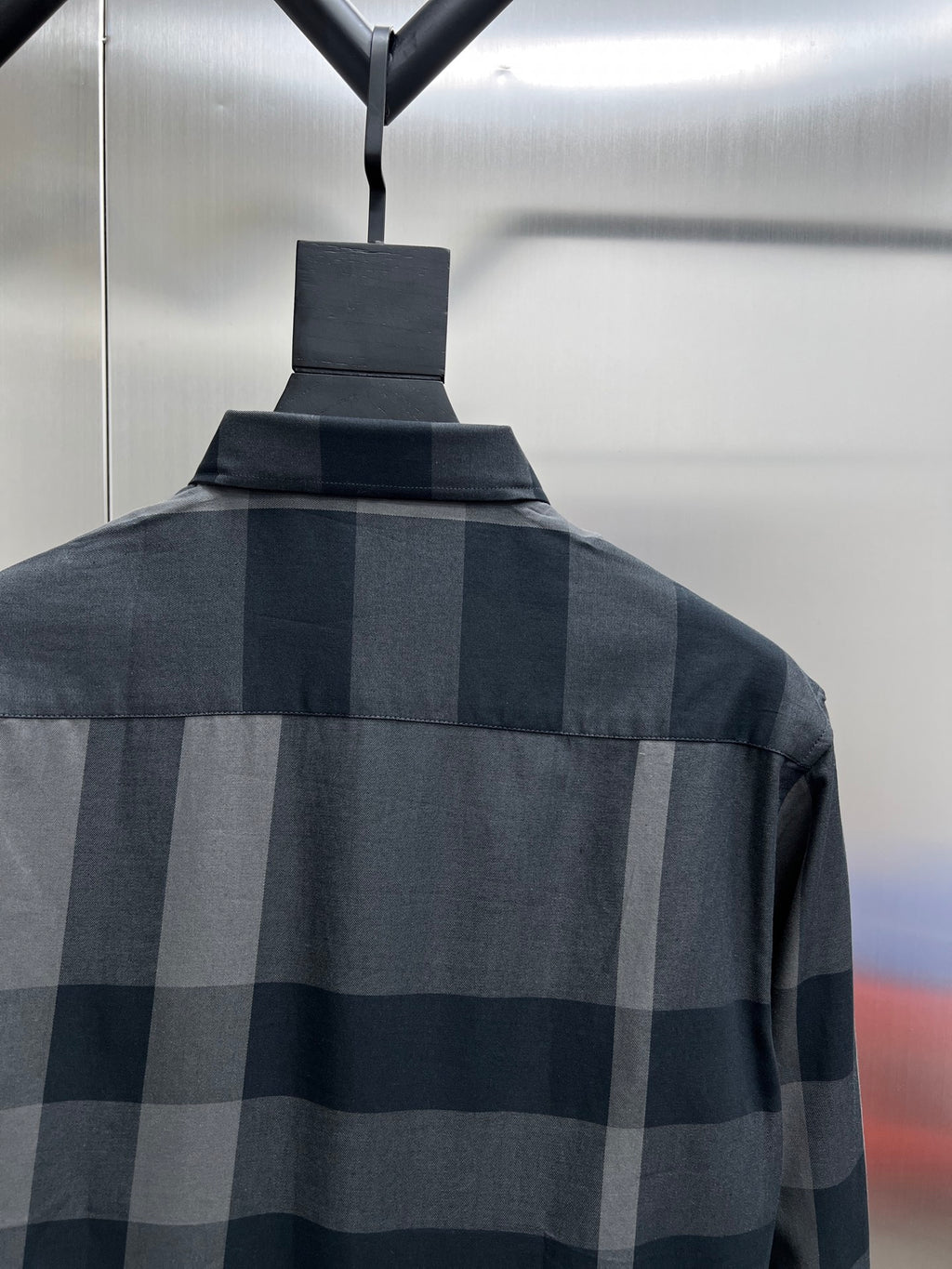 Dark and light plaid long-sleeve shirt back with buttoned collar