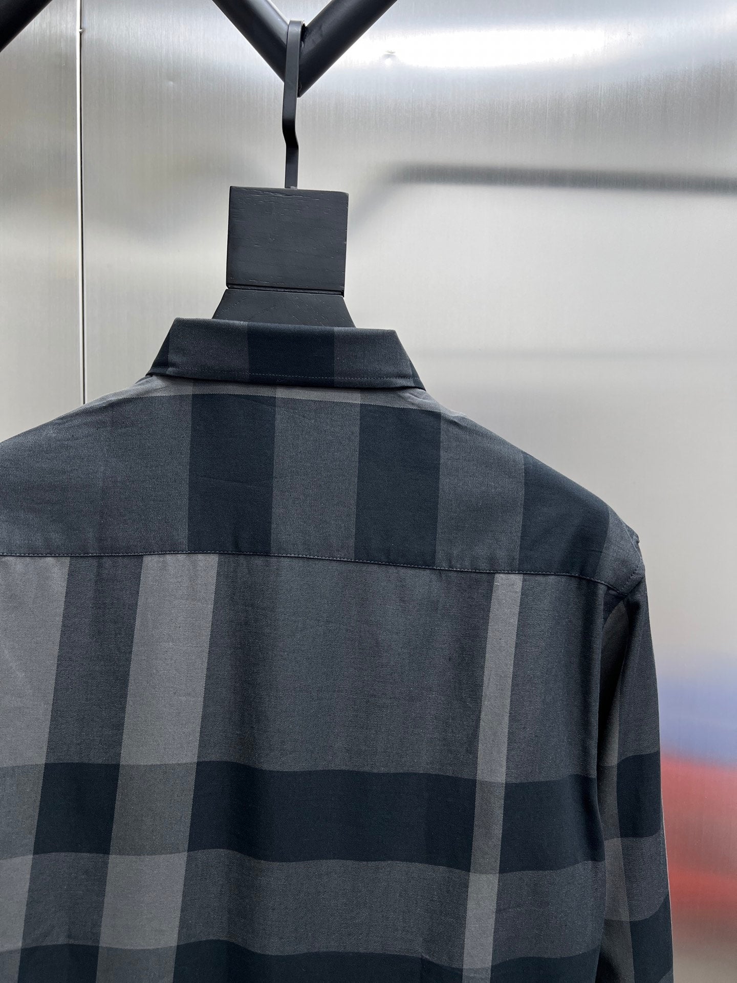Dark and light plaid long-sleeve shirt back with buttoned collar