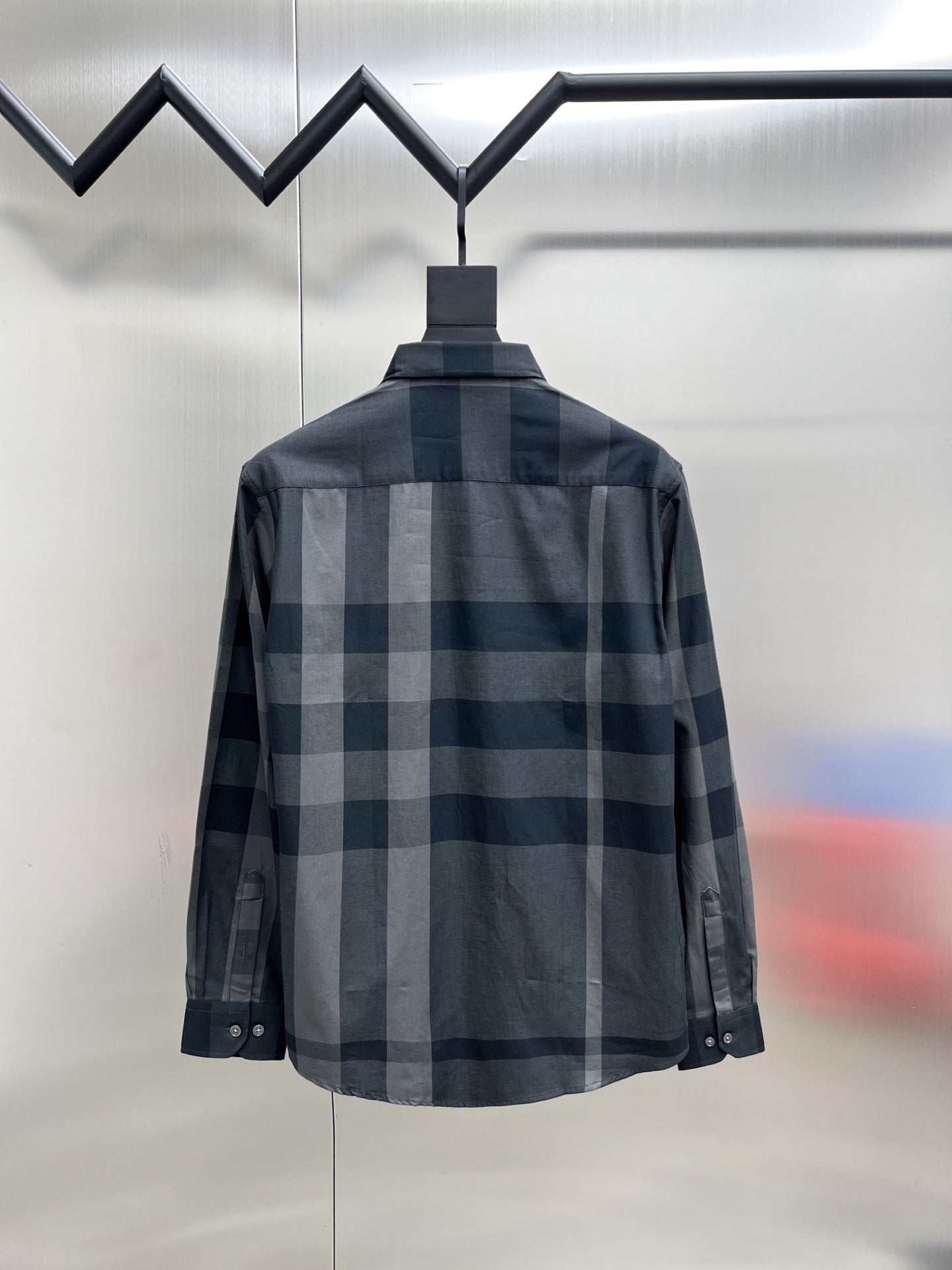 Burberry long-sleeve check shirt, back view, dark blue-gray plaid with button placket