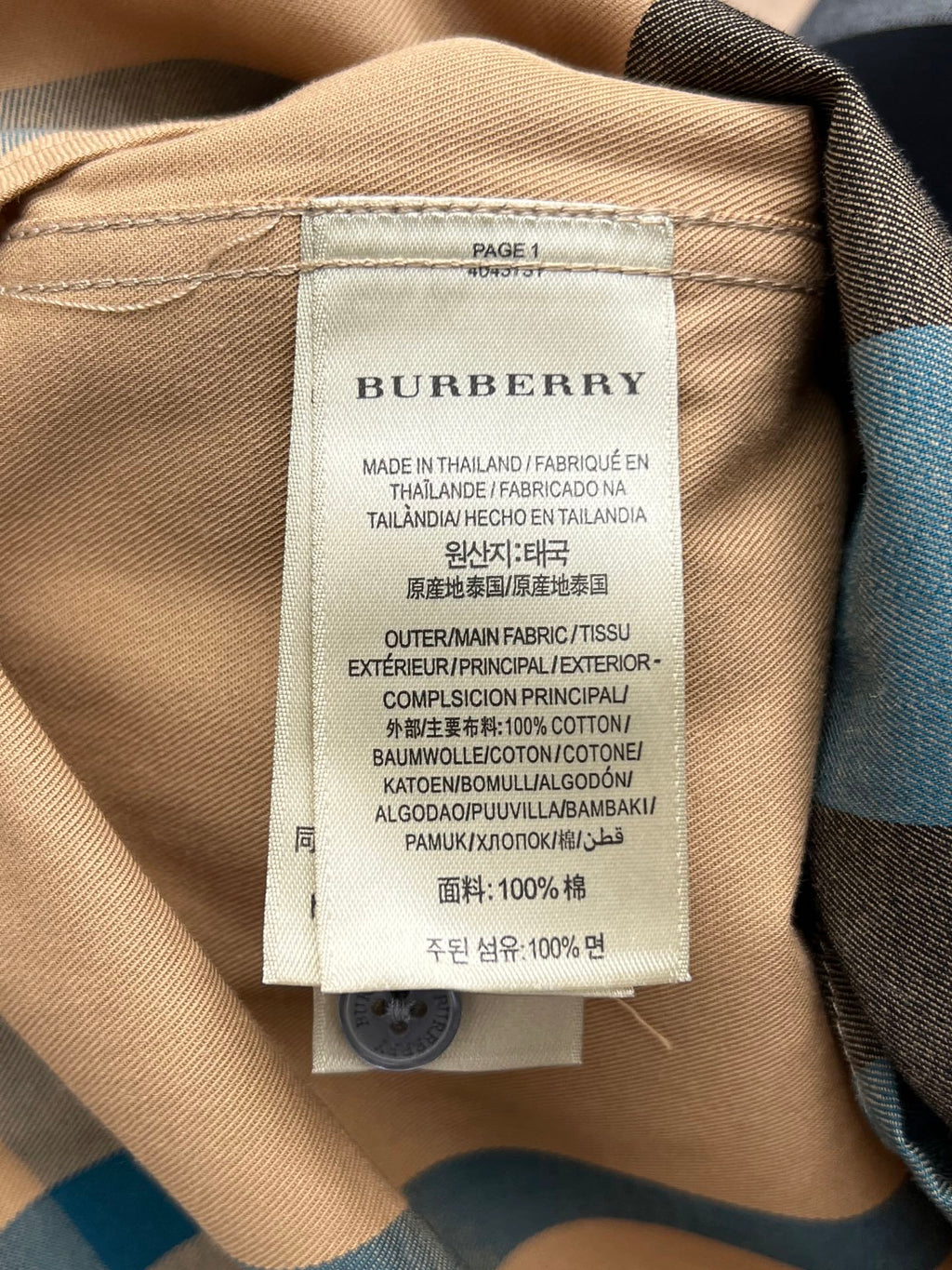 Burberry inner label on tan check-pattern long shirt with care and fabric details
