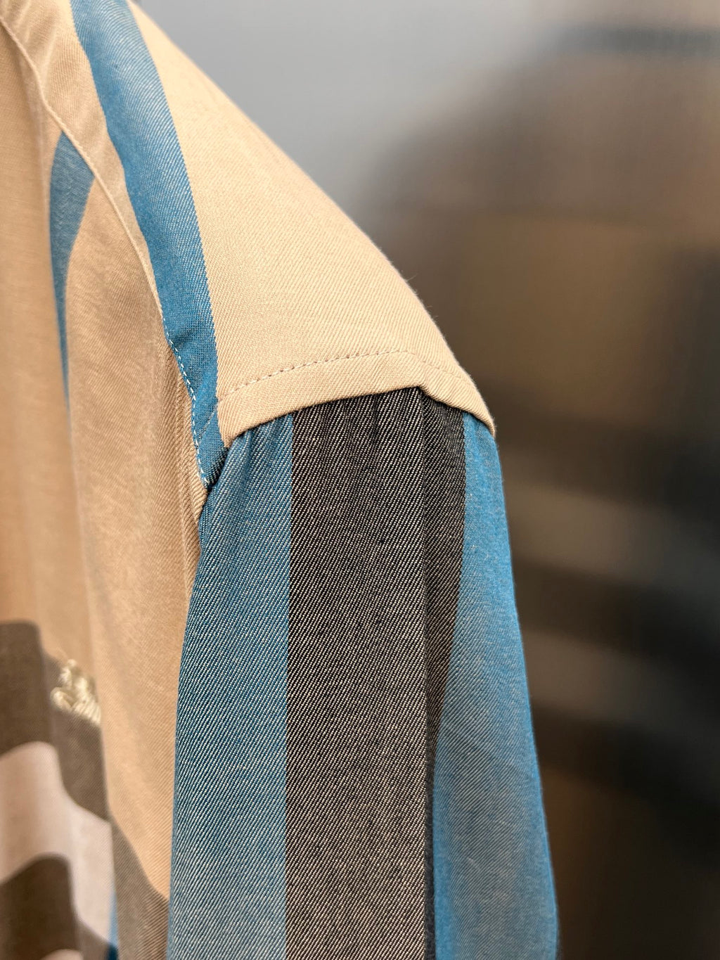 Burberry shirt sleeve in blue, beige, and dark plaid fabric