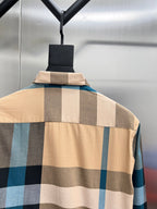 Check-pattern long shirt on hanger with tan, blue, and dark block squares