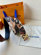 Printed monogram belt with gold-toned LV buckle and patterned strap end