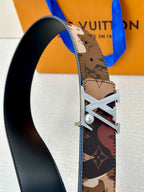 Monogram belt with silver-toned LV buckle and black leather underside