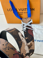 Monogram belt with silver-toned LV buckle and patterned strap, visible buckle detail