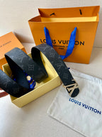 Louis Vuitton monogram belt, dark strap, gold-tone LV buckle shown with box and bag