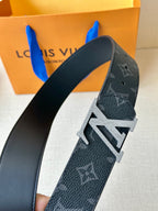 Louis Vuitton monogram belt, dark strap, silver-tone buckle with stitched edge detail
