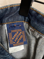 Louis Vuitton Paris fabric label on dark blue denim pocket with gold embroidery