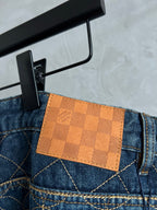 Dark blue denim back pocket with tan check leather patch