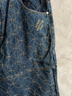 Dark blue denim pants with gold geometric flower embroidery