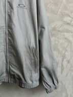 Balenciaga zip-front long jacket in light gray with elastic cuffs and logo patch