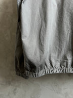 Light gray hooded jacket with elasticated hem at the back