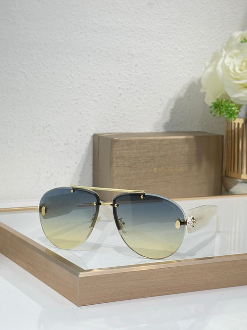 Dark metal sunglasses with blue gradient lenses and gold-tone bridge details