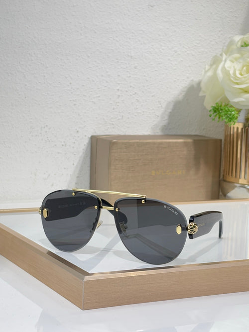 Dark metal sunglasses with gray gradient lenses and gold-tone hardware