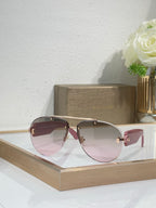 Burgundy sunglasses with pink gradient lenses and gold-tone metal arms