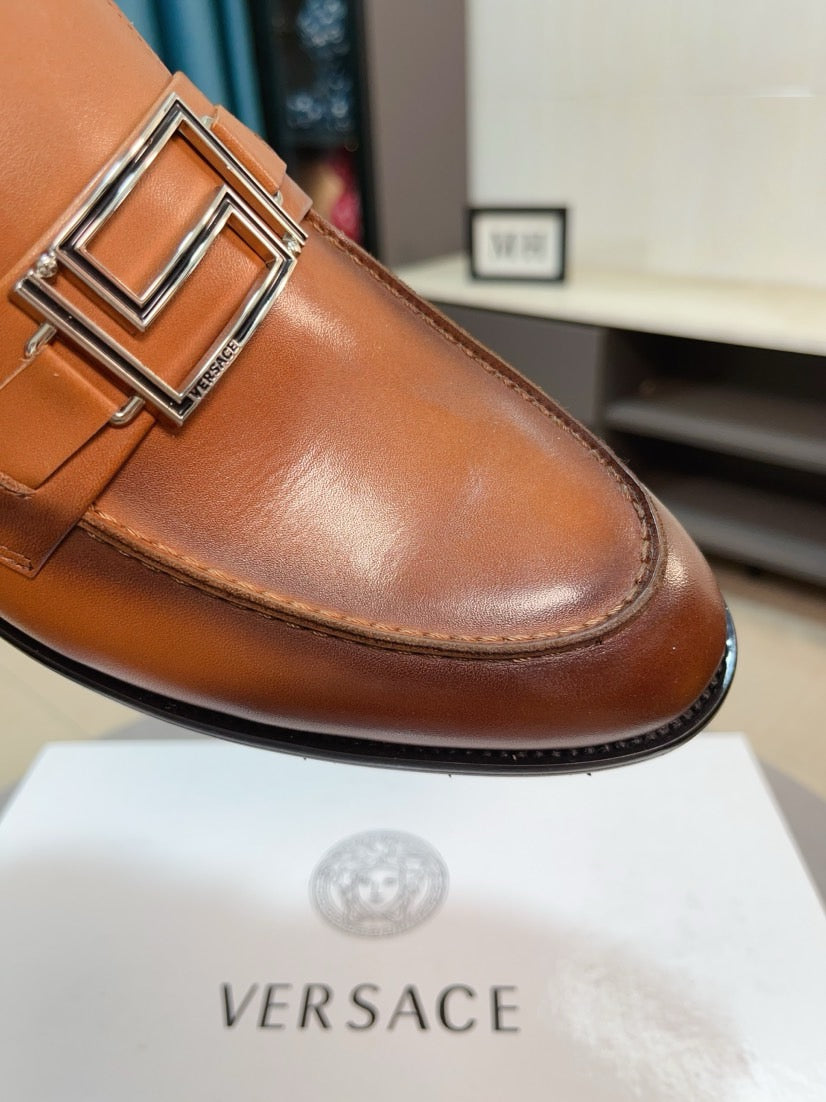 Versace leather loafer detail: square buckle on tan-brown upper with stitching