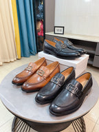 Versace leather loafer pair with square buckle, tan and dark brown colorways