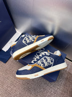 Dior unisex sneakers, navy blue with white sole and tan trim; logo print