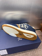 Dior unisex sneakers outsole view, navy upper with white tread and tan base