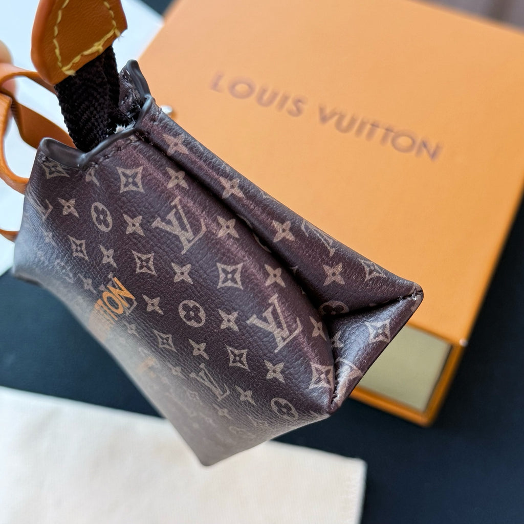 Small Louis Vuitton monogram small bag interior view with zip top and tan trim