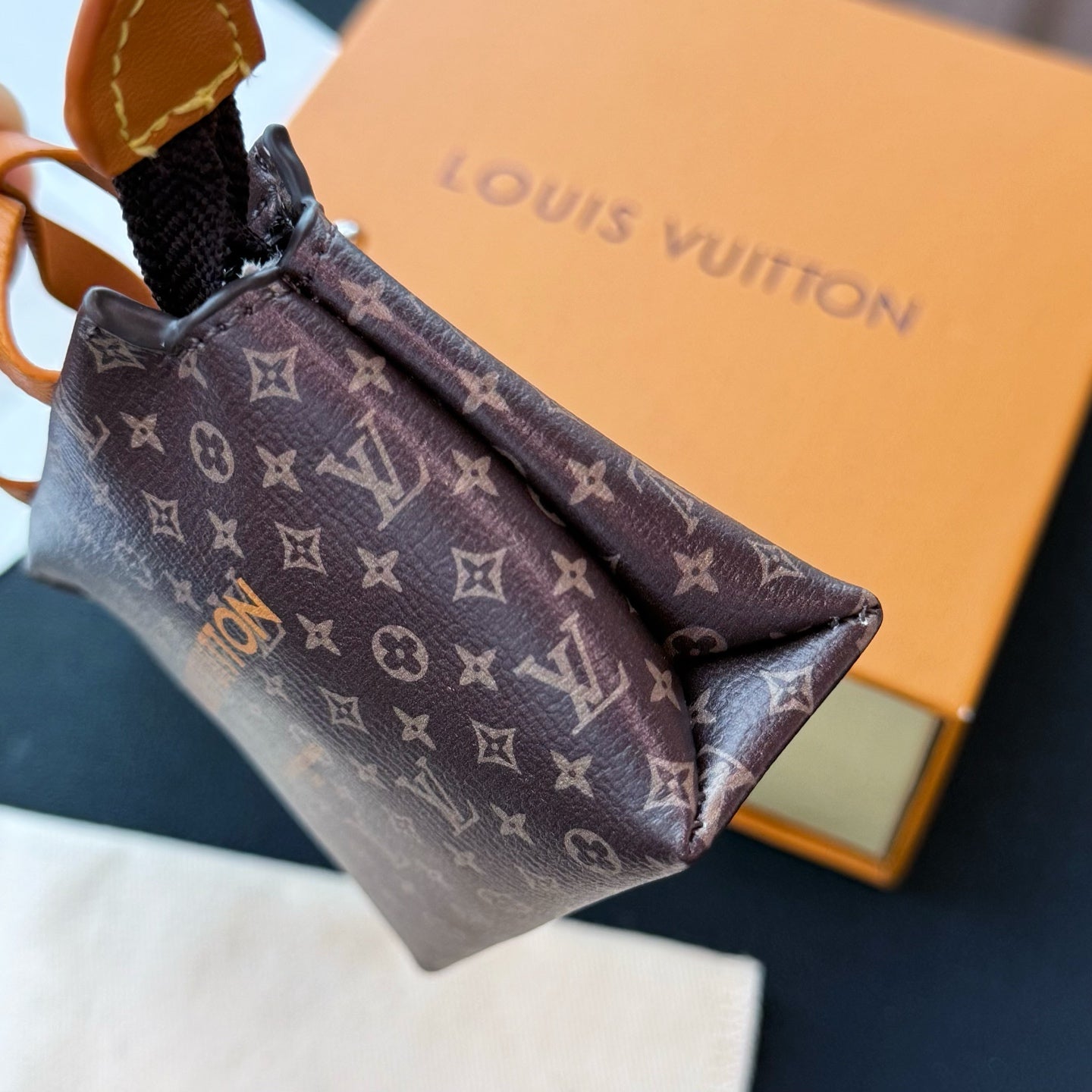 Small Louis Vuitton monogram small bag interior view with zip top and tan trim