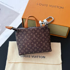 Small Louis Vuitton monogram small tote with tan handle and silver clasp