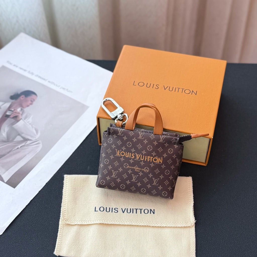 Small Louis Vuitton tote-style bag in dark brown monogram canvas with tan handles