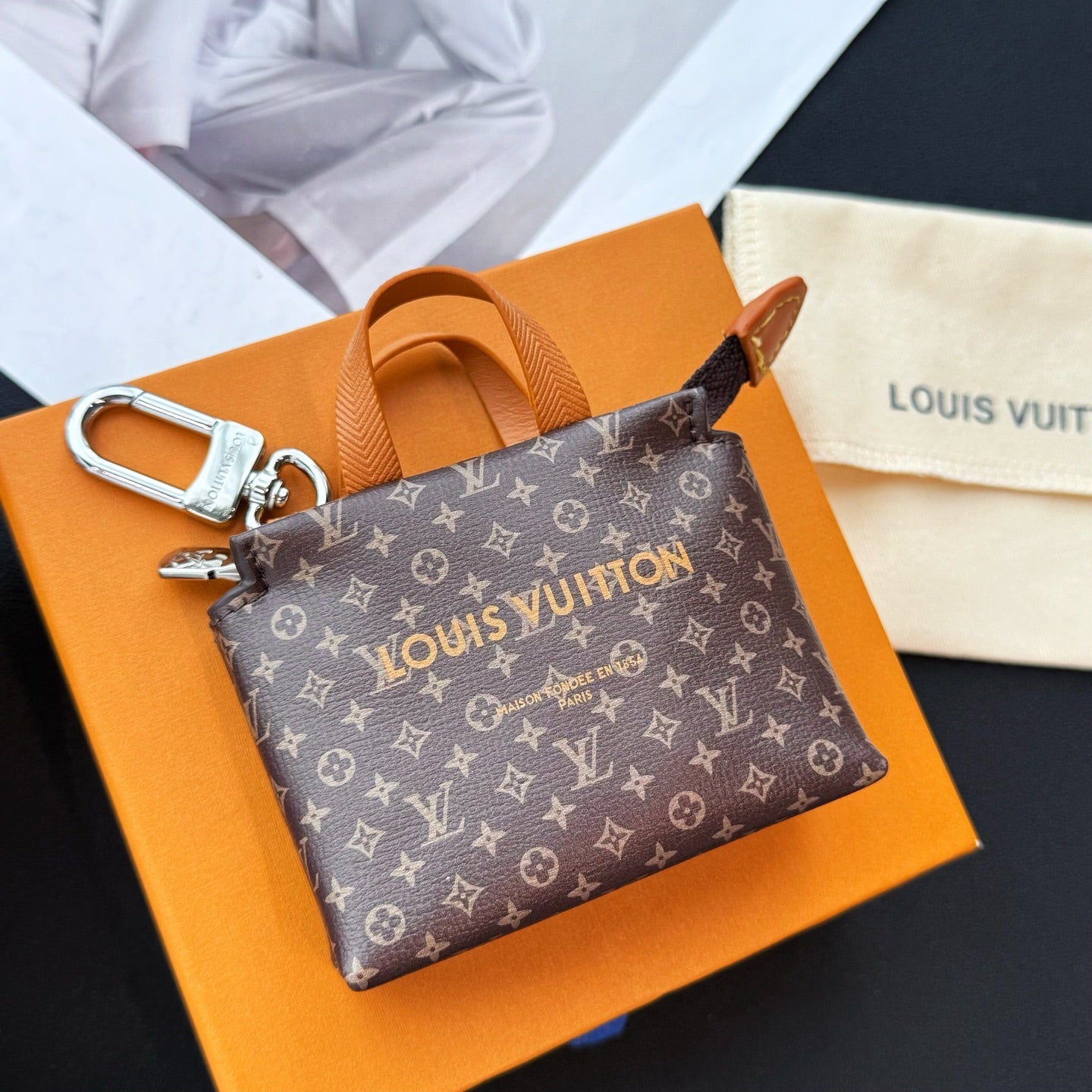 Small Louis Vuitton monogram mini bag with tan handles and silver hardware