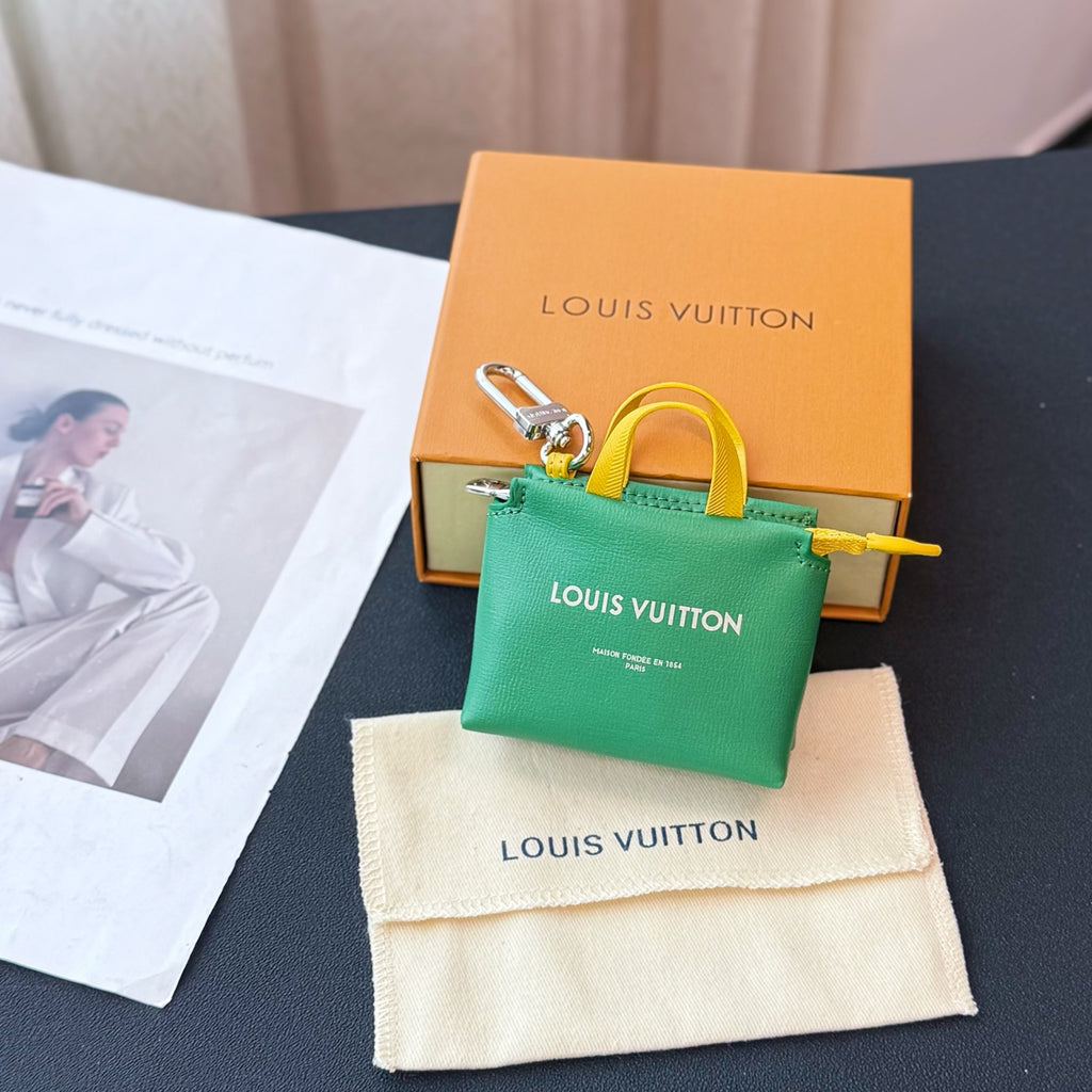Louis Vuitton small bag in green with yellow handles and front logo print