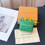Louis Vuitton small bag in green with yellow handles and front logo print