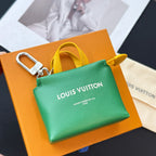 Louis Vuitton small bag in green with yellow strap and silver keyring clasp; front logo