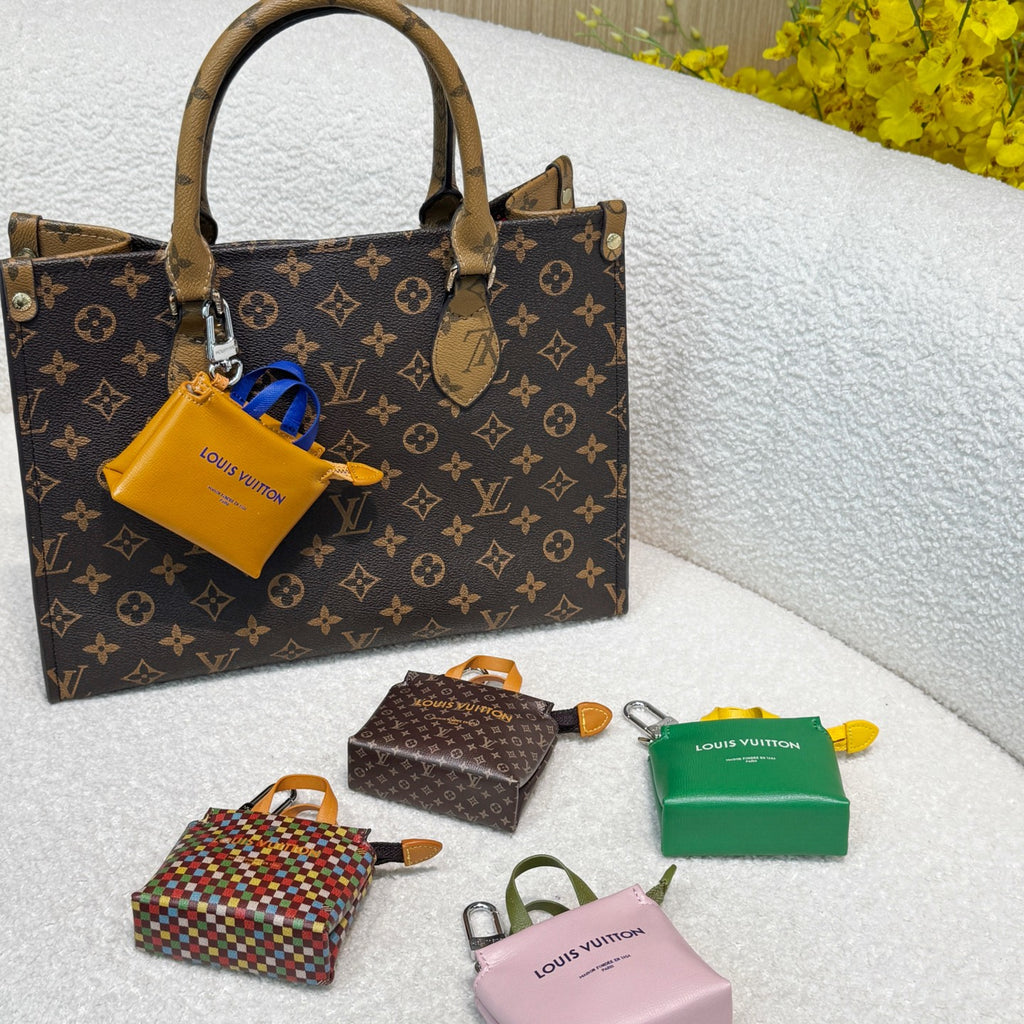 Collection of small monogram handbags with mini pouches in green, pink, orange, multicolor