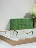 Gucci glasses with gold metal rectangular frame and dark blue temple tips