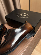 Prada unisex leather derby shoe, dark brown glossy upper with black laces and thick sole